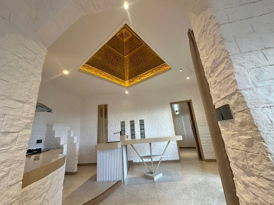 The Pyramid Villa interior with pyramid skylight over the kitchen